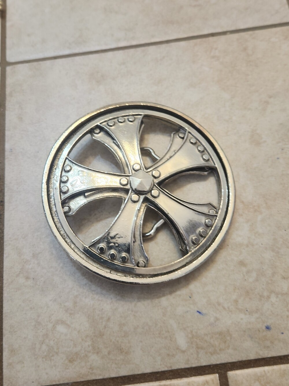 Silver Star Belt Buckle - Spinning Car Tire Wheels